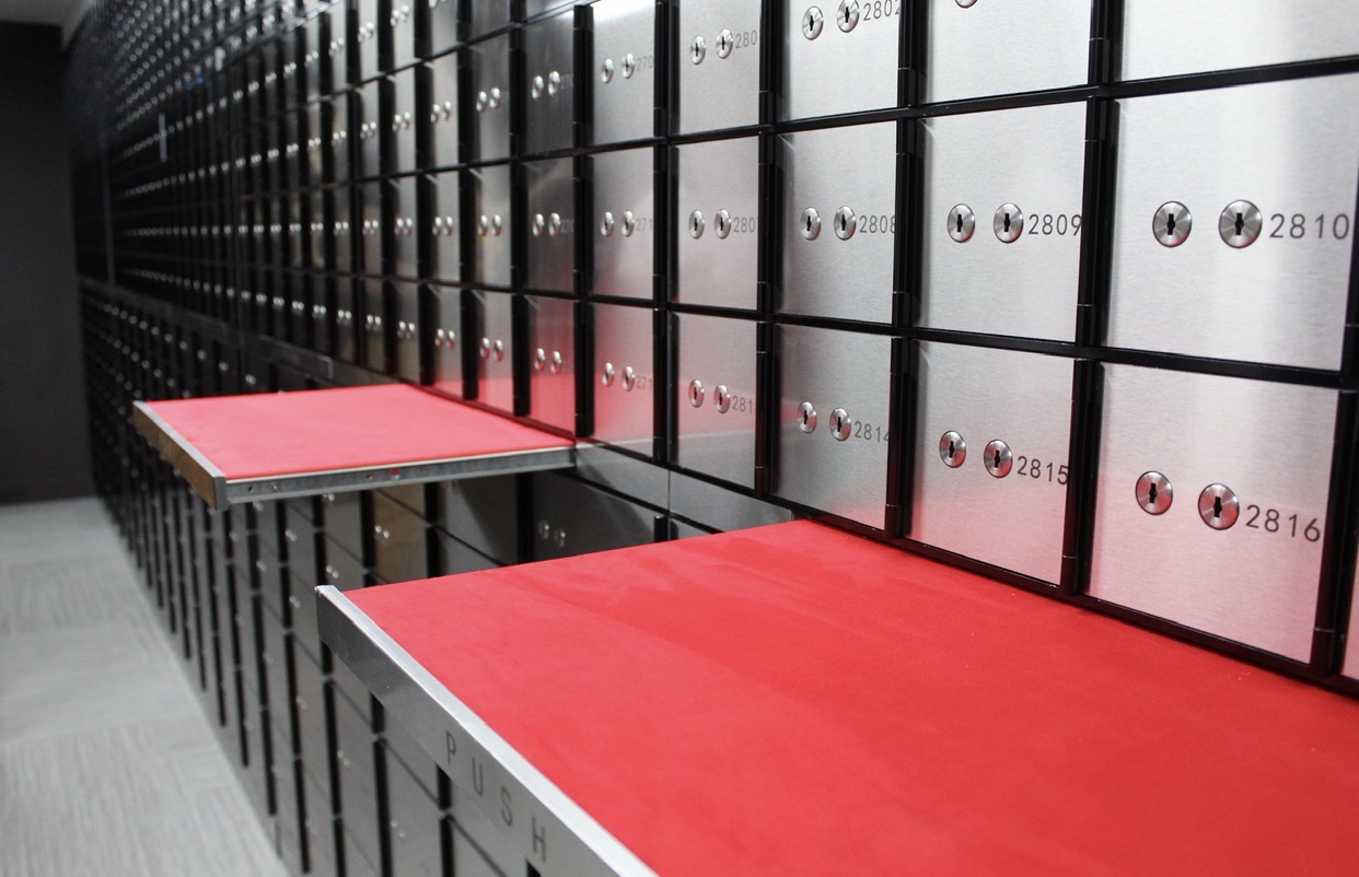 Open safety deposit box with valuables